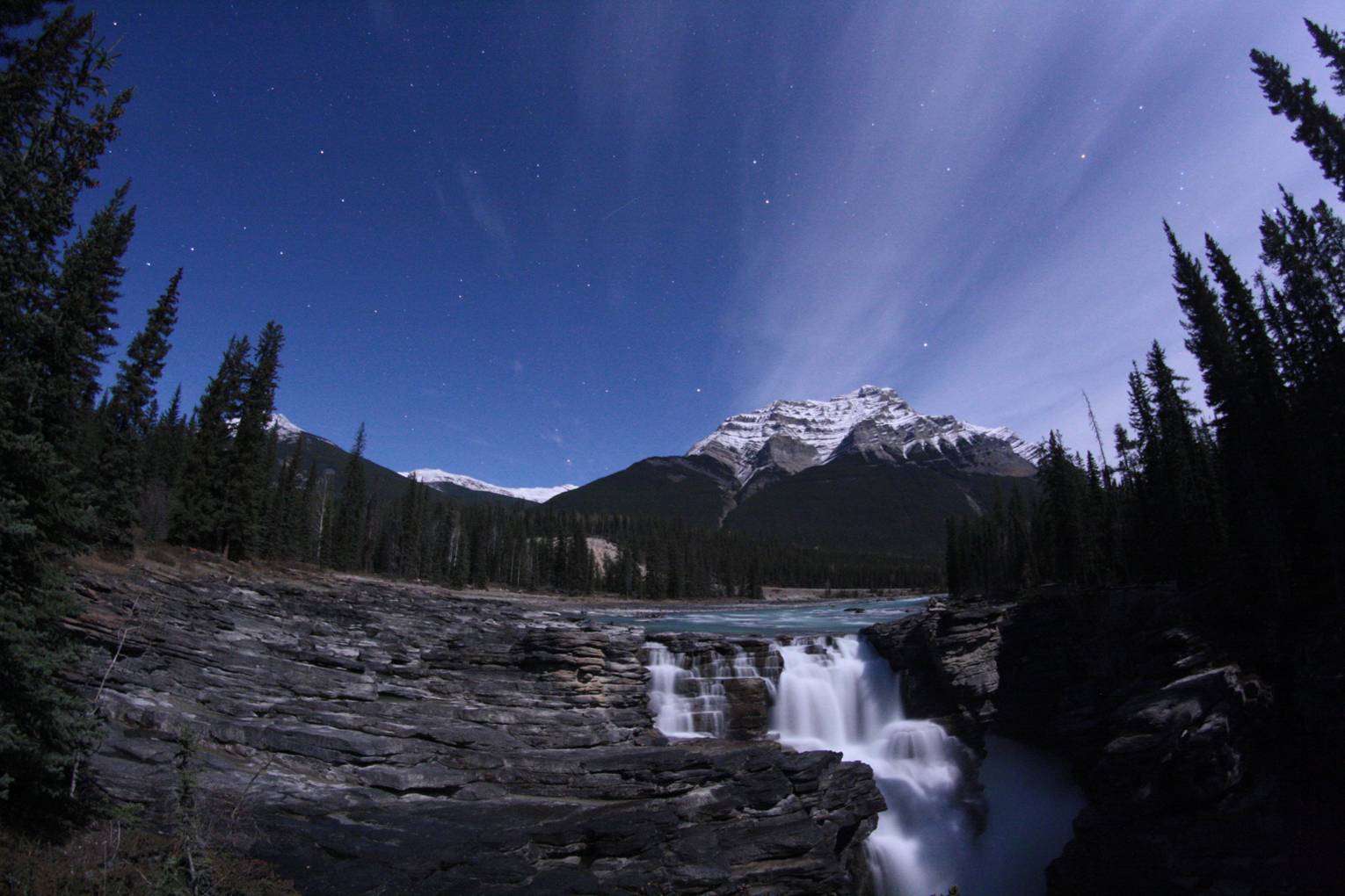 Orion over Athabasca falls in the moonlight in early October